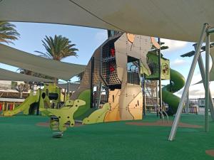 an image of a playground with a slide at HelgaHome in Las Breñas