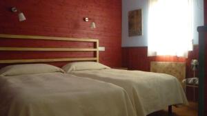 Cama o camas de una habitación en Hostal Los Cerros