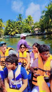 a group of people in a boat on a river at Shalom breaze in Gettapola