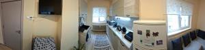 a kitchen with a stove top oven in a room at Apartament Sofia in Sofia +3 photos