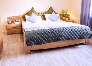 a bedroom with a large bed with pillows at Haus Sonneneck 1 in Bad Zwischenahn