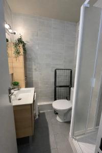 a bathroom with a toilet and a sink at Sakura Seaside -Expérience Japonaise en bord de mer in Argelès-sur-Mer +11 photos