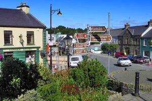a street with many street signs in a town at Hilltop Glamping in Ardara
