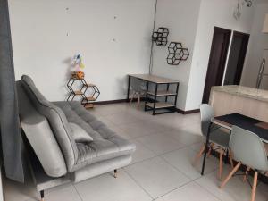 a living room with a couch and a table at Libertad in Tarija