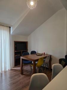 a dining room with a table and chairs at Urban House in Batumi