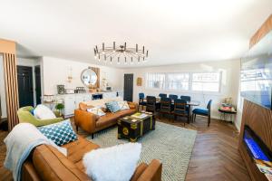 a living room with a couch and a dining room at Chalet 239-Boutique Hotel in West Dover