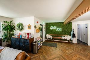 a room with a green wall with a bench at Chalet 239-Boutique Hotel in West Dover