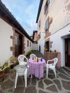 a table and chairs sitting on a stone patio at TXARRENEA in Elizondo