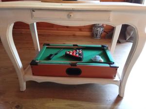 a desk with a pool table on top of it at studio in Puessans +12 photos