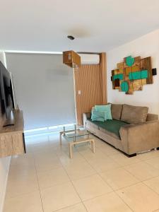 a living room with a couch and a table at Cabildo Apart Familiar in Santiago del Estero