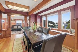 a dining room with a wooden table and chairs at Coastal Craftsman in Pacific City
