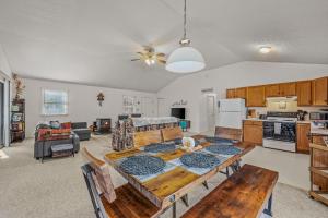 a kitchen and living room with a table and a dining room at Namba Cabin - Feel the Bliss in Morton Grove