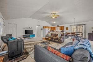 a living room with a couch and a tv at Namba Cabin - Feel the Bliss in Morton Grove
