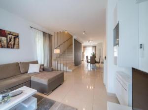a living room with a couch and a table at Villa Anita in Gruda +81 photos