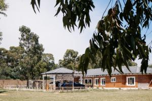 a building with a gazebo in front of it at L a Grande deluxe in Benoni