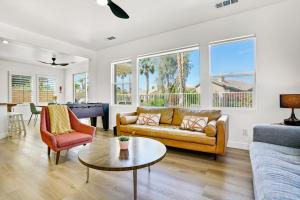 a living room with a couch and a table at Indio Access Vacation Home in Indio