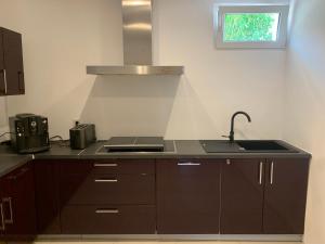 a kitchen with a sink and a stove at Wohnung zur Langzeitmiete geeignet in Bad Kreuznach