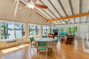 a dining room with a table and chairs at What A View - Zero Steps To The Dock! Yearround Water in Crane Hill
