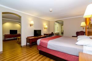 a hotel room with a bed and a desk at Motel 6-Newark, DE in Newark