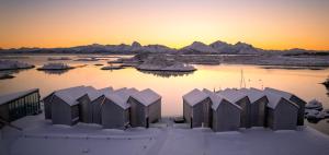 a view of a body of water with snow at Ringstad Resort in Bø