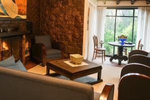 a living room with a couch and a fireplace at Finca La Mara in Tibasosa +59 photos