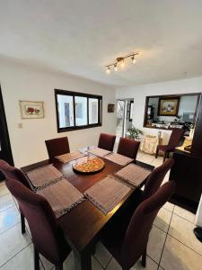 a dining room with a table and chairs at Casa ELA Candelaria in Antigua Guatemala