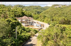 an aerial view of a house in the mountains at Wrightian in Kupuis