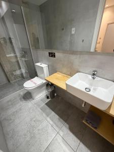 a bathroom with a sink and a toilet at athensdot in Athens
