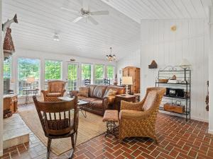 a living room with a couch and chairs at Smith Lake Retreat - Close To Trident Marina in Crane Hill
