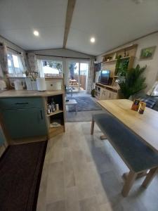 a kitchen with a large table in a room at Boat 32 in Boat of Garten