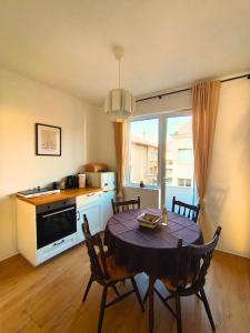 a kitchen and dining room with a table and chairs at Serenity and cosy Lodge, next to NDK! in Sofia