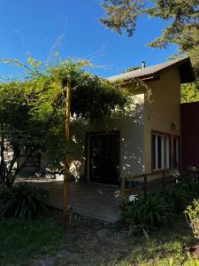 a small house with a porch in front of it at Villa Serena Deportista in Necochea