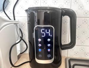 a black coffee maker with a remote control on it at TRA CIELO e MARE da VALE in Fano