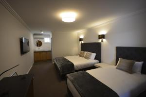 Postel nebo postele na pokoji v ubytování Quays Hotel