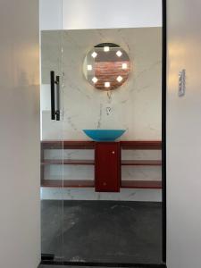a bathroom with a sink and a mirror at Pousada dos Bougainvilles in Manhã +31 photos