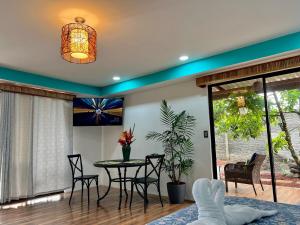 a dining room with a table and chairs at Sassy Sloth Villa in Fortuna