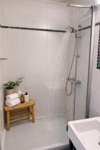 a bathroom with a shower and a sink at Le refuge de Séve - Loft de Yves in Momignies +26 photos