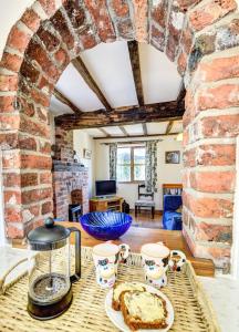 a room with a table with a cake on it at 1 Bed in Welshpool oc-75714 in Meifod +19 photos