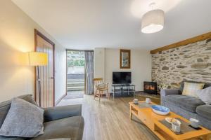 a living room with a couch and a table at 4 Bed in Builth Wells oc-39461 in Builth Wells