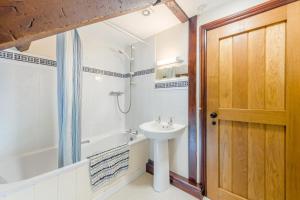 a bathroom with a sink and a tub and a toilet at 4 Bed in Builth Wells oc-39461 in Builth Wells +31 photos