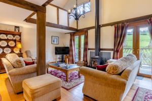 a living room with two couches and a fireplace at 2 Bed in Caersws oc-waa345 in Trefeglwys