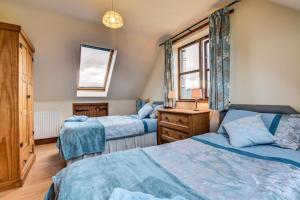 a bedroom with two beds and a window at 2 Bed in Welshpool oc-75703 in Meifod