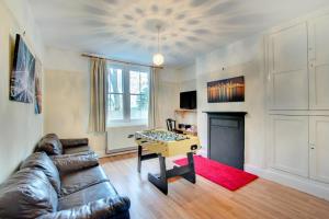 a living room with a couch and a table at 6 Bed in Dolgellau oc-wah675 in Arthog