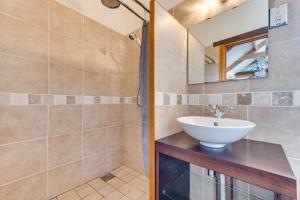 a bathroom with a sink and a mirror at 1 Bed in Gower oc-hh408 in Llanmadoc +8 photos