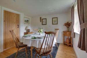 a dining room with a table and chairs at 1 Bed in Frittenden oc-cb564 in Frittenden +10 photos