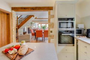 a kitchen with a table with a tray of food on it at 2 Bed in Upper Quinton oc-p33608 in Mickleton
