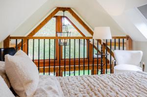a bedroom with a bed and a large window at 2 Bed in Upper Quinton oc-p33608 in Mickleton
