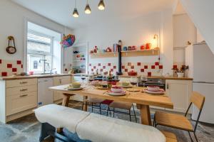 a kitchen with a wooden table and chairs in a kitchen at 3 Bed in Hawes oc-ds959 in Hawes