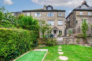 a large stone house with a green yard at 4 Bed in Masham oc-ds1007 in Masham