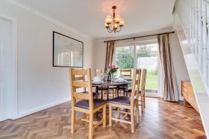 a dining room with a table and chairs at 3 Bed in Nicholaston oc-hh676 in Nicholaston